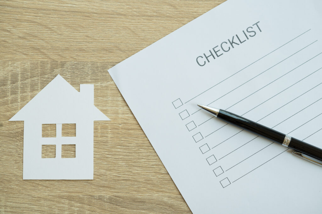 Closed up of checklist with house inspection - to do list